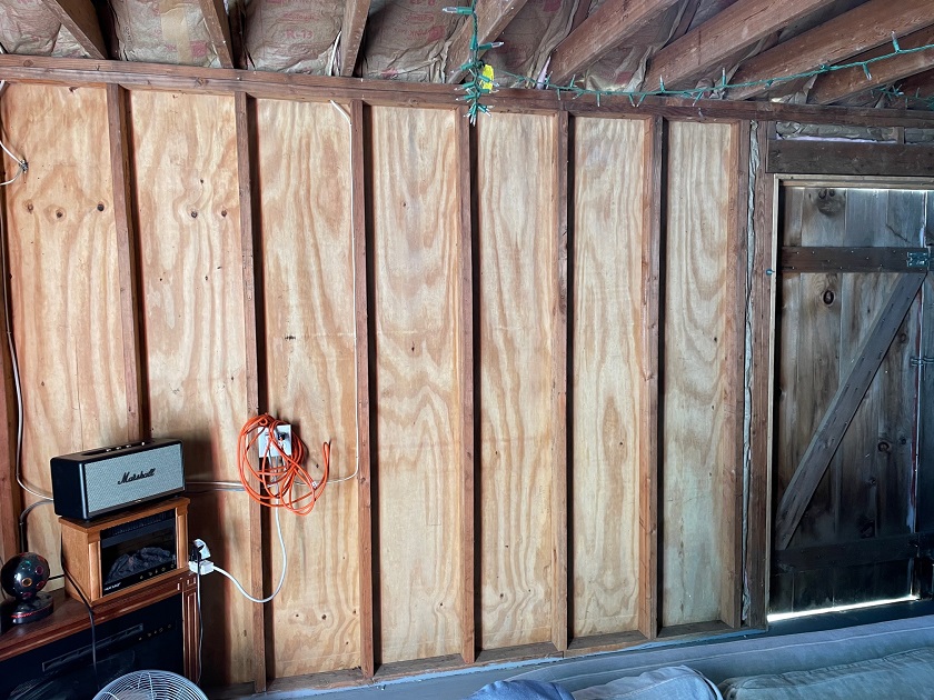 Slide 1: This picture shows the wall from inside the shed that the window will be added to, left of the door.